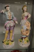 A pair of large continental bisque porcelain figure groups.