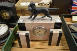 An Art Deco clock garniture.