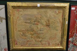 An embroidered picture depicting a hunting dog in a gilt frame.