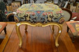 A good carved gilt framed stool with Brussels needlework upholstered seat.