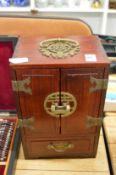 A small Chinese tabletop cabinet.