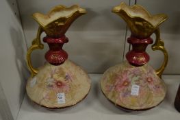 A pair of decorative porcelain ewers.