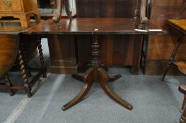 A mahogany pedestal table.