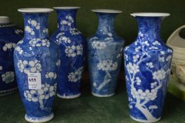 Four Chinese blue and white prunus pattern vases, one with rim chips.