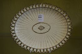 An oval cream ware dish.