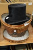 A leather cased top hat, internal measurement 7.5ins x 6ins.
