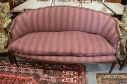 A George III design mahogany framed curved back settee on tapering square legs.