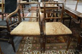 A set of eight George IV mahogany rope twist dining chairs, two with arms.