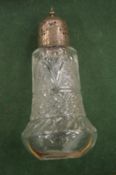 A cut glass and silver mounted sugar caster.