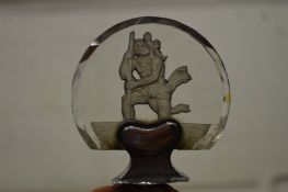 An intaglio carved glass car mascot St. Christopher.