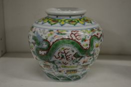 A small Chinese Famille Verte dragon vase.