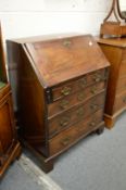 A George III mahogany bureau of small size.