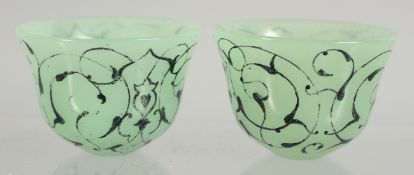 A SMALL PAIR OF ISLAMIC GLASS CUPS, 6cm diameter.