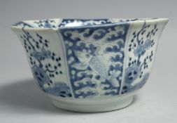 A JAPANESE BLUE AND WHITE ARITA PORCELAIN OCTAGONAL FORM BOWL, decorated with panels of fish and