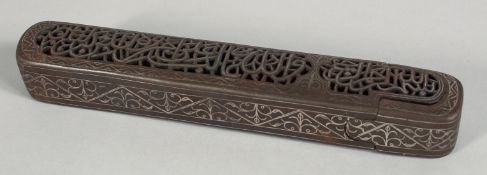 A 19TH CENTURY ISLAMIC OPENWORK PEN BOX, inlaid with silver wire decoration, the top with openwork