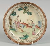 A CHINESE FAMILLE ROSE / CORAL RED PORCELAIN SHALLOW BOWL with pierced border, the centre painted