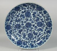 A VERY LARGE CHINESE BLUE AND WHITE PORCELAIN DISH, the interior painted with blue and white