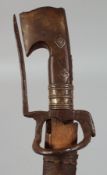 AN ANTIQUE ETHIOPIAN RHINO HORN HILTED SWORD, with leather and wood scabbard, 101cm overall.