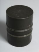 A CHINESE CYLINDRICAL METAL TEA CADDY, the base with impressed mark. 10cm high