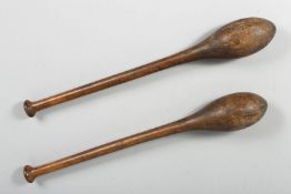 A PAIR OF 19TH CENTURY INDIAN EXERCISE WOODEN CLUBS, 53cm long.