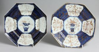 A PAIR OF CHINESE BLUE AND WHITE OCTAGONAL PORCELAIN DISHES, with gilt foliate decoration. 25cm at