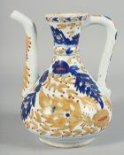 A TURKISH KUTAHYA POTTERY WATER JUG, painted with foliate decoration, 21.5cm high.