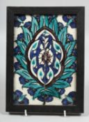 A 17TH CENTURY OTTOMAN DAMASCUS FRAMED TILE, painted with floral design, overall 24cm x 18cm.