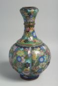 A JAPANESE GREEN GROUND CLOISONNE VASE, decorated with multiple flower heads, 31cm high, (af).
