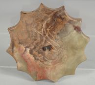 AN ISLAMIC BEKTASHI PRAYER STONE, 9cm diameter.