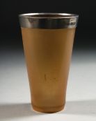 A BOVINE HORN BEAKER WITH SILVER BAND, 9.5cm high.