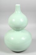 A GOOD LARGE CHINESE CELADON GLAZE DOUBLE GOURD VASE, the base with six-character mark. 33.5cm high