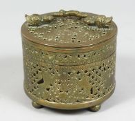 A 19TH CENTURY INDIAN BRASS OPEN WORKED BOX, depicting a British emblem, with hinged lid and handle,