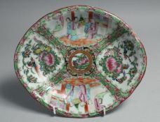 A CHINESE CANTON FAMILLE ROSE PORCELAIN DISH, painted with panels of figures, flora and fauna, 25.