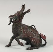 A CHINESE BRONZE DRAGON FORM CENSER, with traces of red paint, lid section to the back, 24cm high.