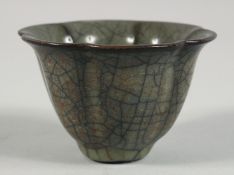 A CHINESE GE WARE PETAL FORM CUP, 8.5cm diameter.