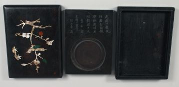 A CHINESE STONE INKWELL IN A FITTED HARDWOOD BOX, the box inlaid with mother of pearl decoration,