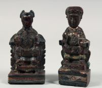 TWO CHINESE CARVED AND LACQUERED WOOD ANCESTOR FIGURES, 14cm and 13.5cm high, (2).