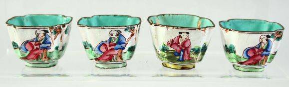 FOUR CHINESE ENAMELLED SALTS, each decorated with figures in an outdoor setting, 4.5cm diameter, (