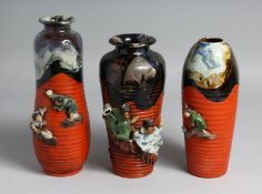 THREE JAPANESE SUMIDA POTTERY VASES, partly glazed with ribbed body and figures in relief, one