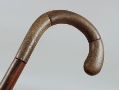 AN ANTIQUE RHINO HORN WALKING STICK, 85cm long.**Please note: this item can only be sold within th