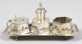 AN IRAQI SILVER NIELLO SILVER FOUR PIECE CRUET SET, (4).