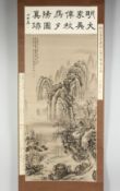 A CHINESE SCROLL PAINTING ON SILK depicting a mountainous landscape with buildings and trees, with
