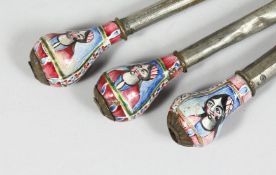 THREE 19TH CENTURY PERSIAN QAJAR ENAMELLED HUQQA MOUTH PIECES, the enamelled ends decorated with