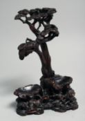 A CHINESE CARVED AND PIERCED HARDWOOD TREE FORM STAND, 17cm high.