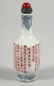 A CHINESE PORCELAIN SNUFF BOTTLE AND STOPPER, the body with calligraphy, the stopper inset with a