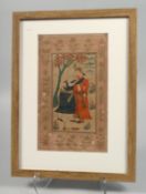 A PERSIAN SAFAVID MINIATURE PAINTING ON PAPER, depicting two figures with a floral border, framed