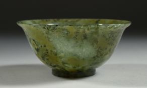 A SMALL CHINESE SPINACH JADE BOWL, 10cm diameter.