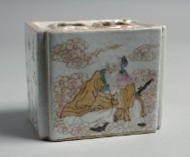 A CHINESE PORCELAIN INKWELL, painted with figures and script, 10cm wide.