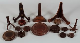 A QUANTITY OF CHINESE HARDWOOD STANDS, various styles and sizes, largest circular stand 14.5cm