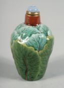 A CHINESE PAK CHOI FORMED PORCELAIN SNUFF BOTTLE AND STOPPER, the base with four-character mark, 7.